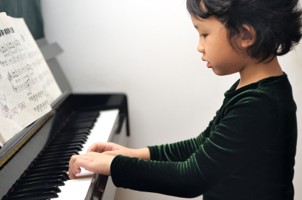 Asian kid playing piano